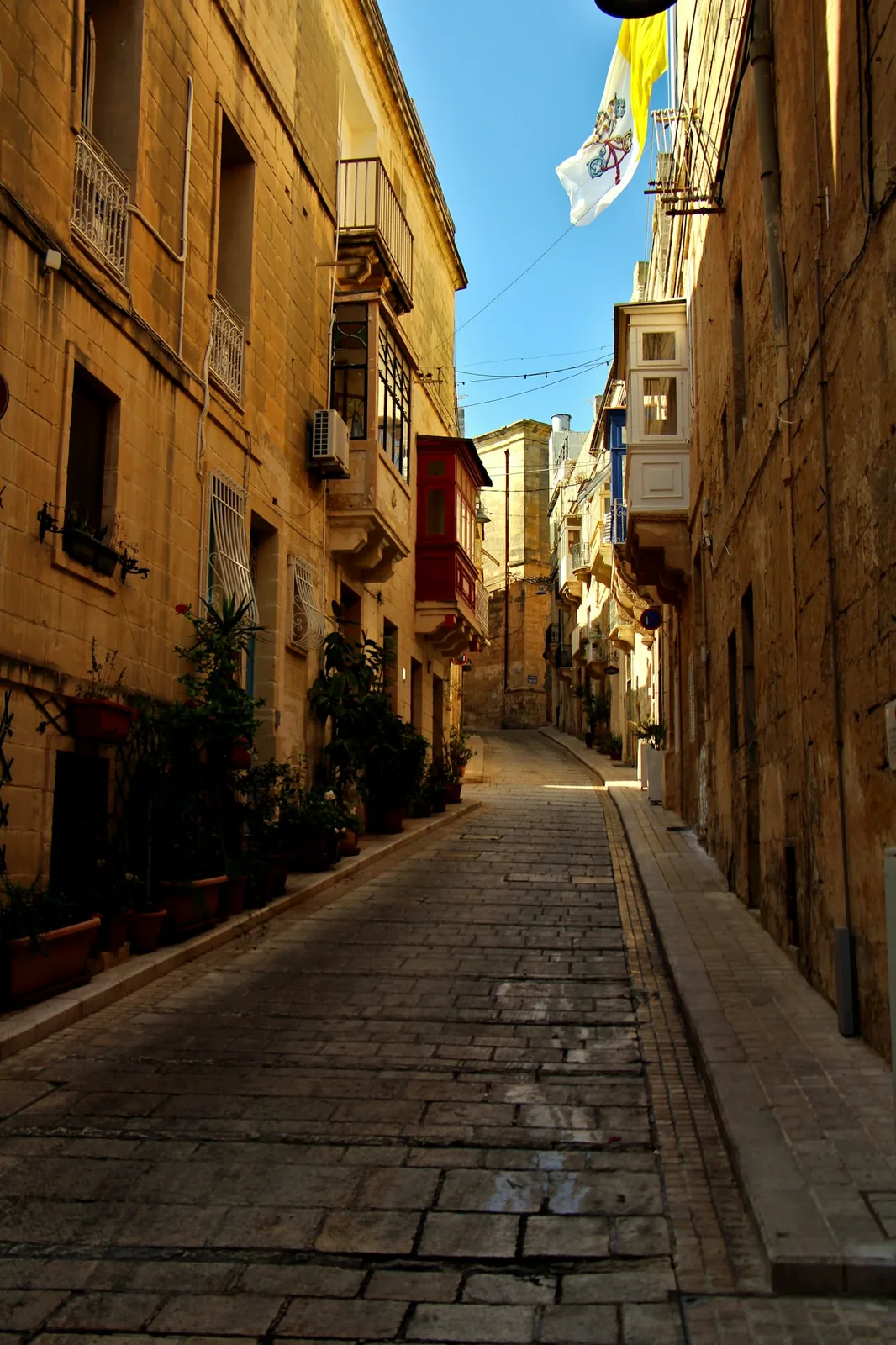 Sunny stone alley in Valletta, Malta